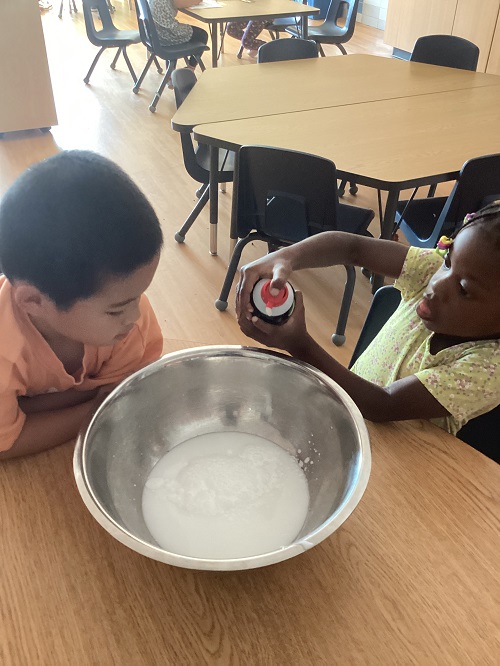 School age children participating in a science experience 