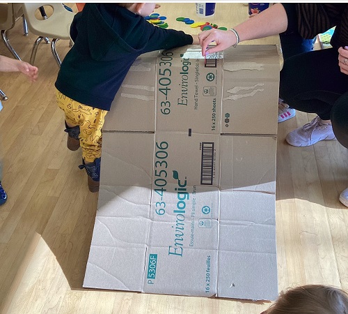 ramp made out of a cardboard box attached to a table 