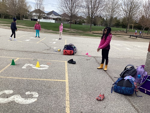 School-age girl making obstacle course