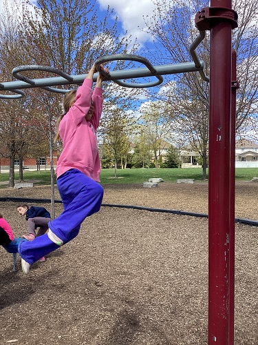 Child on monkeybars