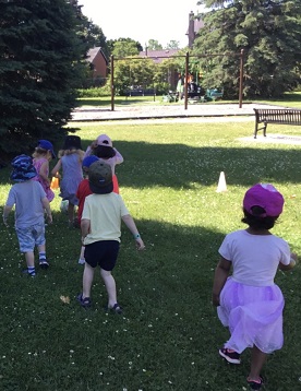 Game of soccer at the park with preschool children