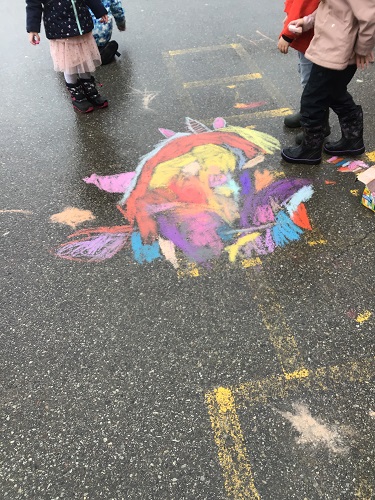 A colourful chalk drawing on the pavement