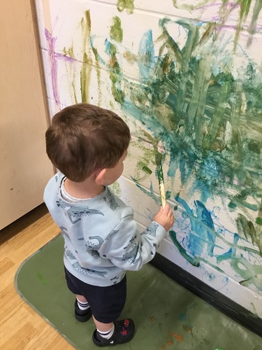 Children painting on the wall