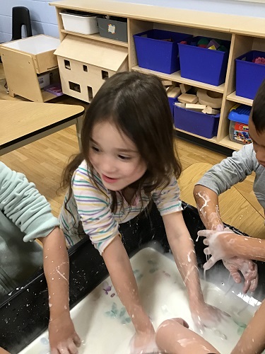 Children playing in oobleck