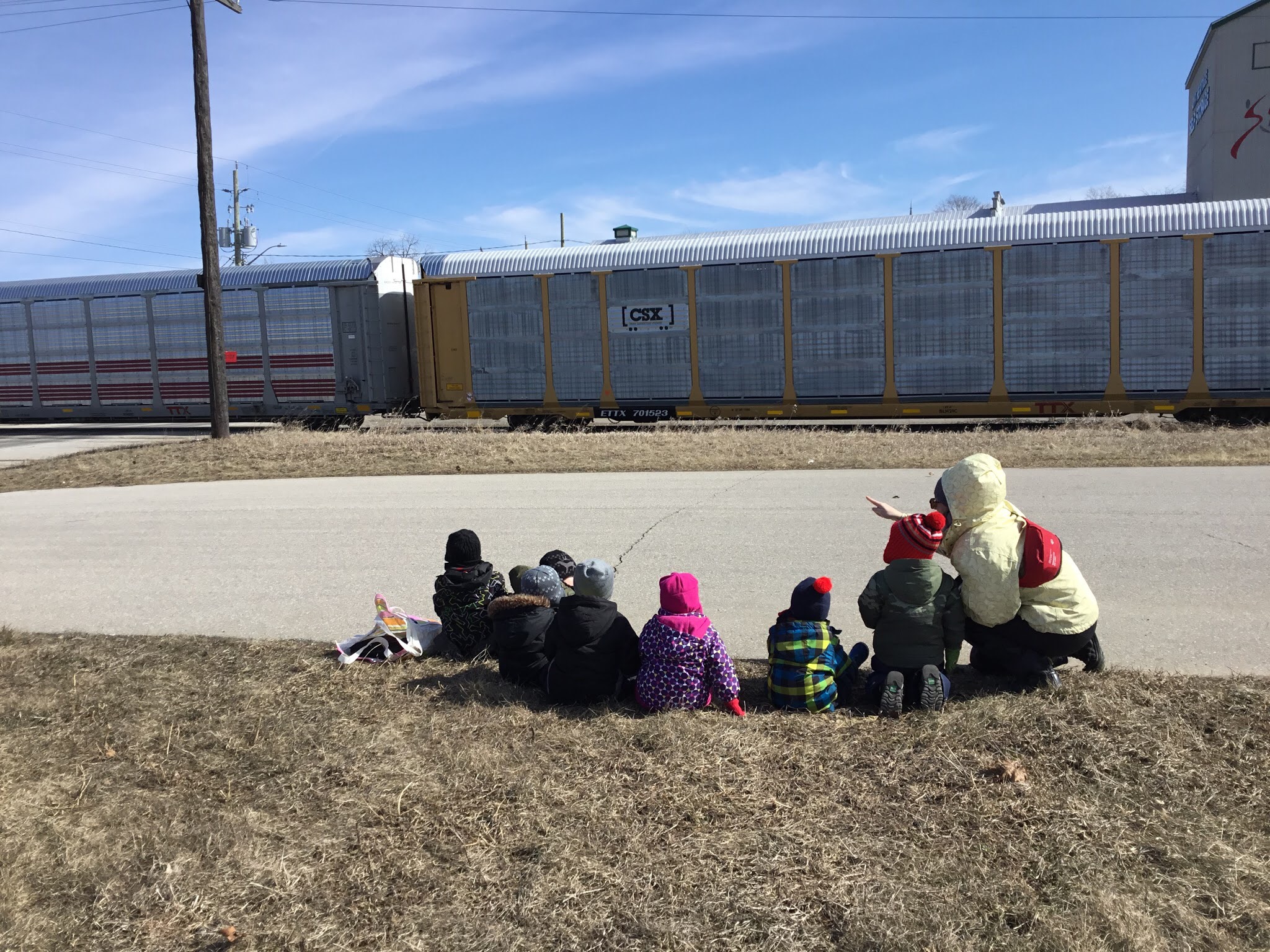 kids watching a train go by