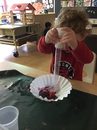 Preschool child dying coffee filter red