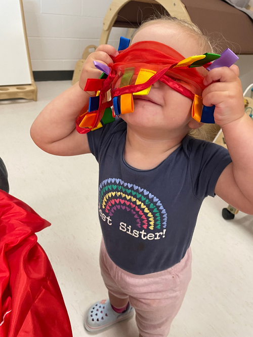 A child exploring different materials