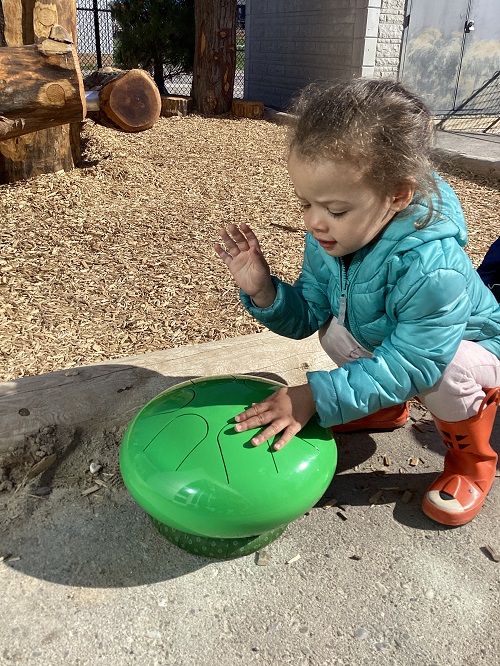 A child exploring the thunder drum