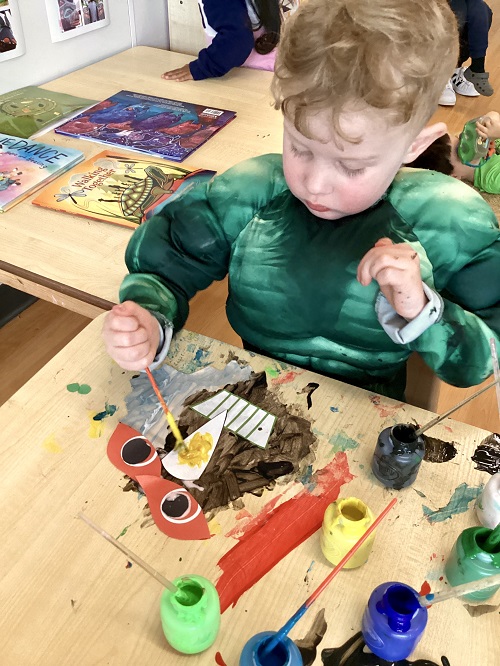 A child working on their creation.
