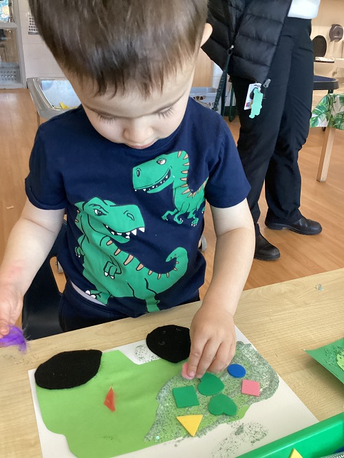 A child creating a garbage truck.