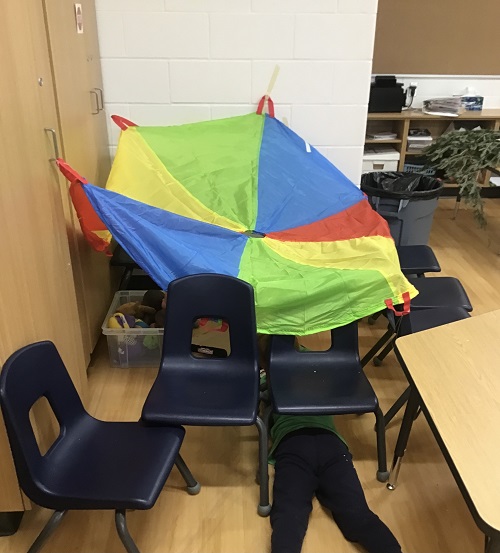 A fort built by the children, using a parachute