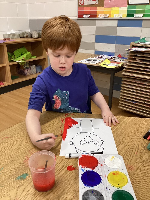 A child painting a picture.