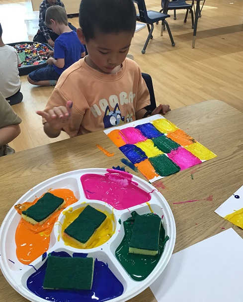 A school age child creating art