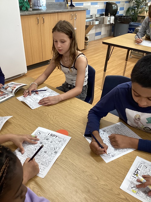 School age children working at a table