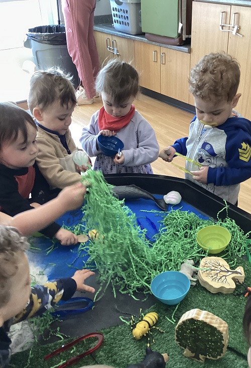 Children exploring the animal habitats in the tuff-tray.