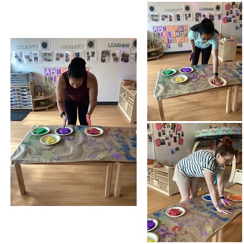 Educators adding their handprints to paper