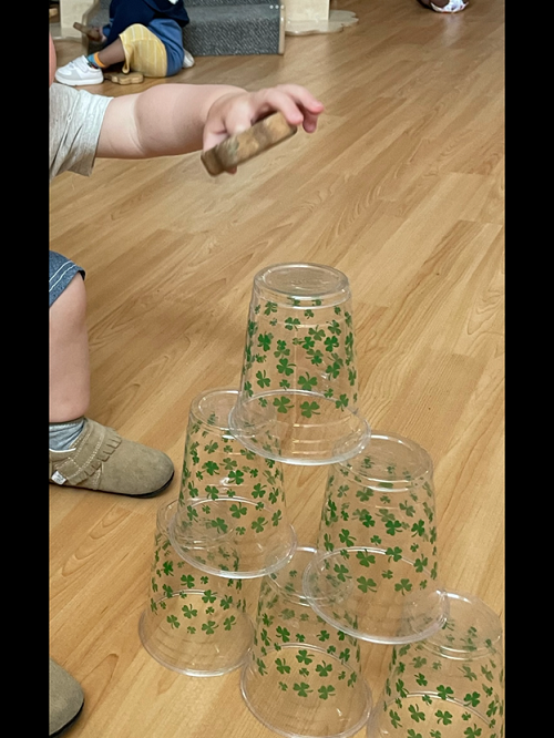 A child stacking cups