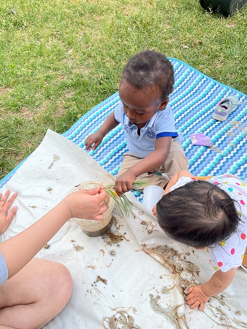 2 children exploring nature materials
