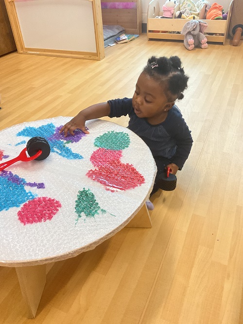 1 child sitting and painting