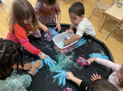 Washing hands in the tuff tray