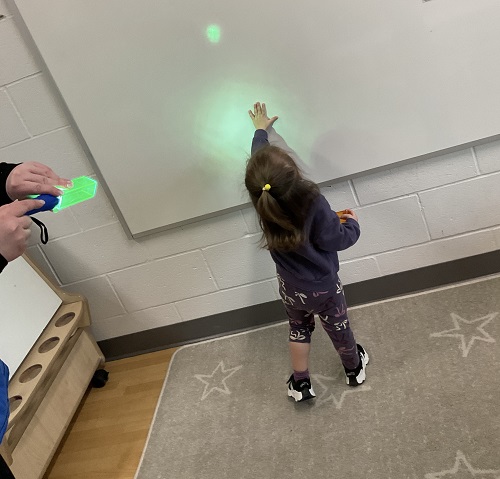 1 child at the white board - green light