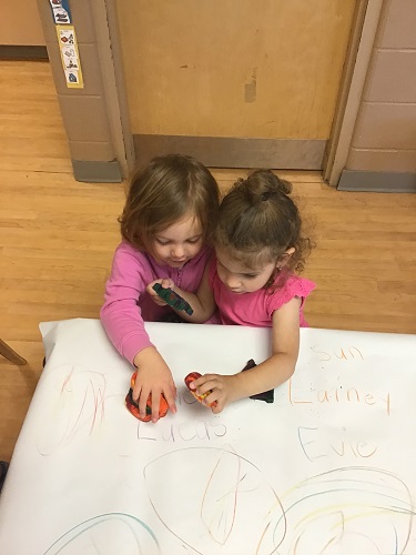 Children colouring with crayons