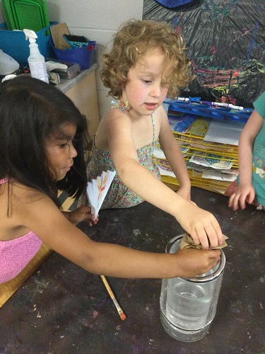 Experimenting by adding coloured hot water to cold water jar