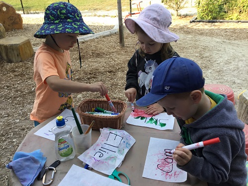 Children painting their names