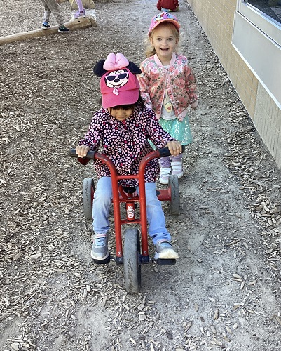 Preschool children exploring outside