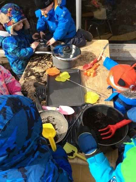 playing in the mud kitchen
