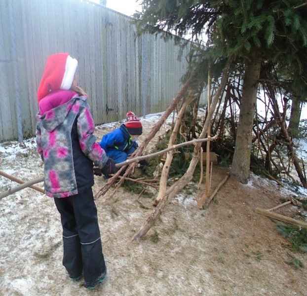 children building a teepee