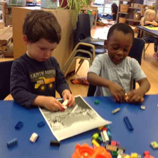 boys building with lego