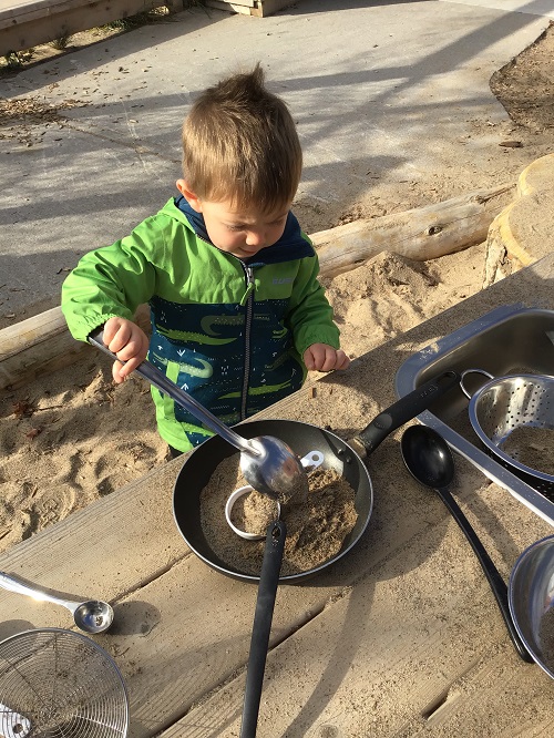 boy with large spoon and pan