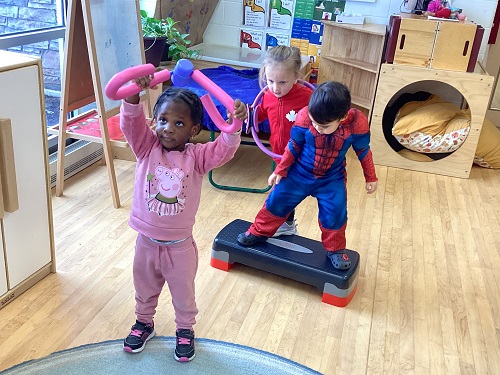 two children using exersize equipment.