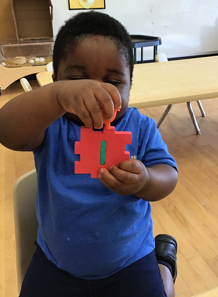 child playing with foam number blocks