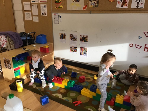 a group of children exploring blocks