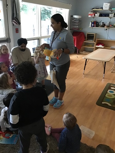 Educator speaking to children about the activity