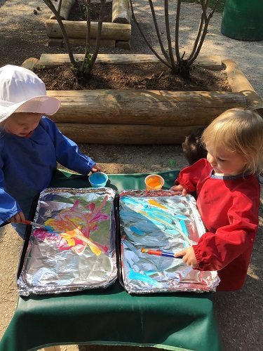 two children painting 