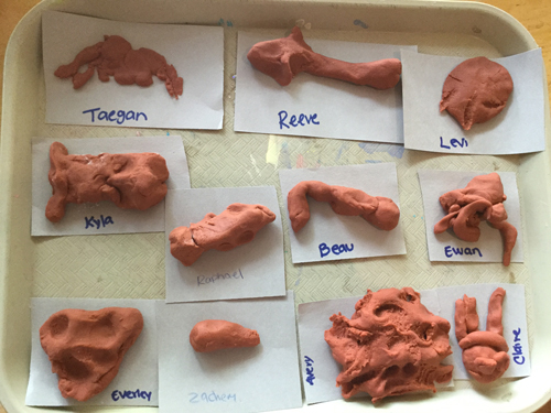 Childrens' sculptures of ant parts made from playdough