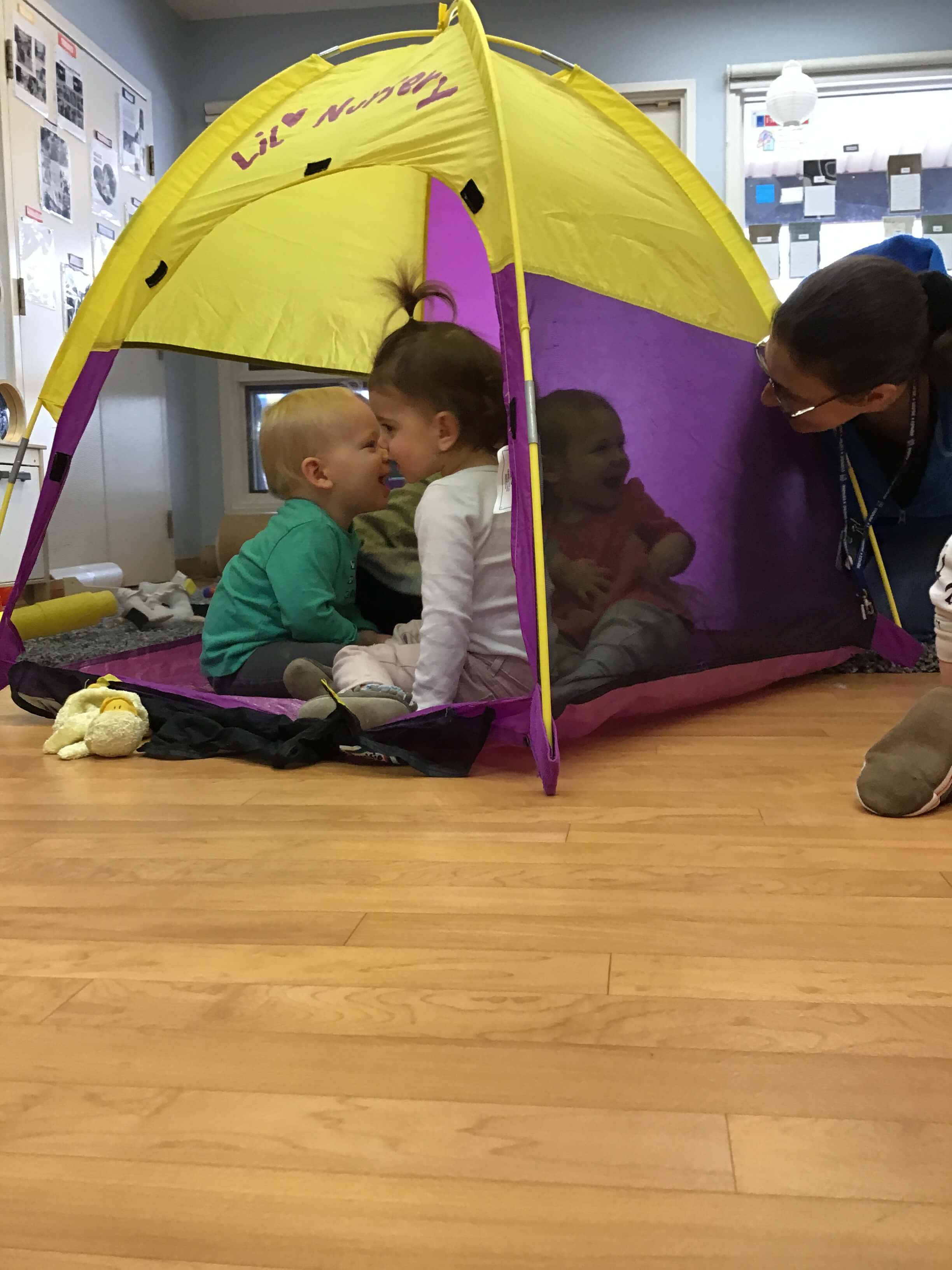 children hiding in a tent