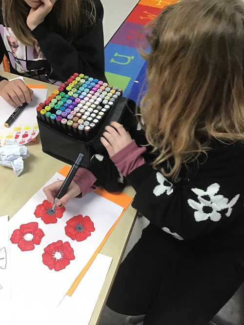 child coloring poppies