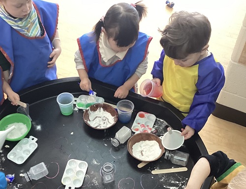 children mixing ingredients together in small bowls