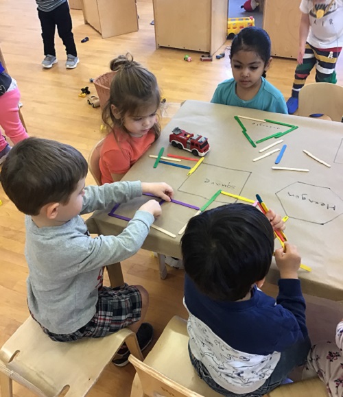 Children participating in a shape matching activity. 