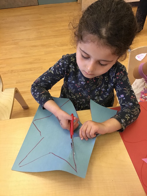 Child Cutting a star shape.