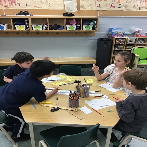 Gropu of children engaged in drawing.