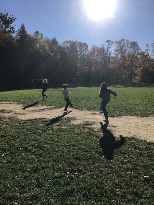 Children running in the field. 