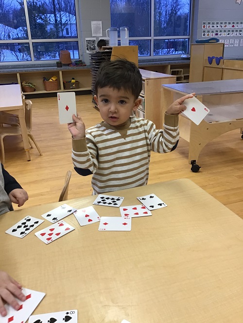 Child showing they had found a card match.
