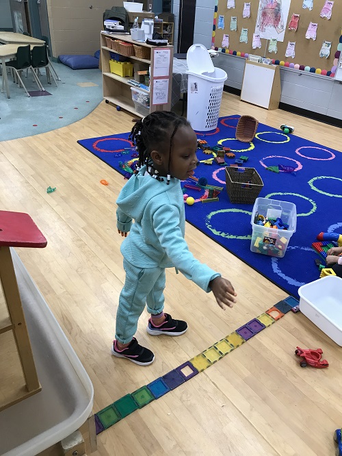 Child taking their turn to throw the ball
