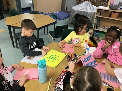 Children creating their Valentine cards