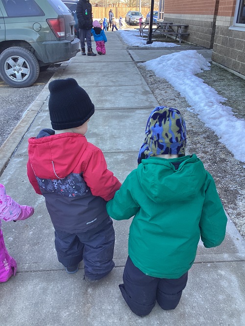 Toddlers engaged in their walk.